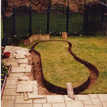 This is the garden marked out ready, turf has been removed and the perimeter trench has been dug out, retaining the turf for use in the bog area.